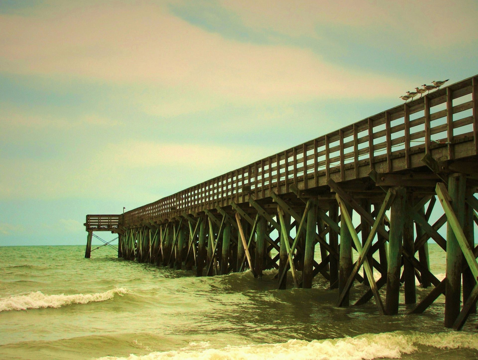 A Very Long Wooden Pier Going Into the Ocean — Charleston, SC — Charleston Glass Co