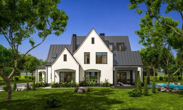 A man is installing a gutter on the side of a house.