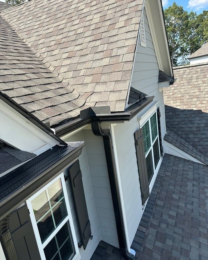An aerial view of a house with a roof and windows.