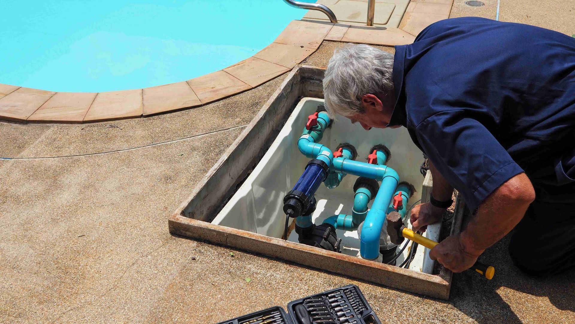 Man checking the pool mechanism