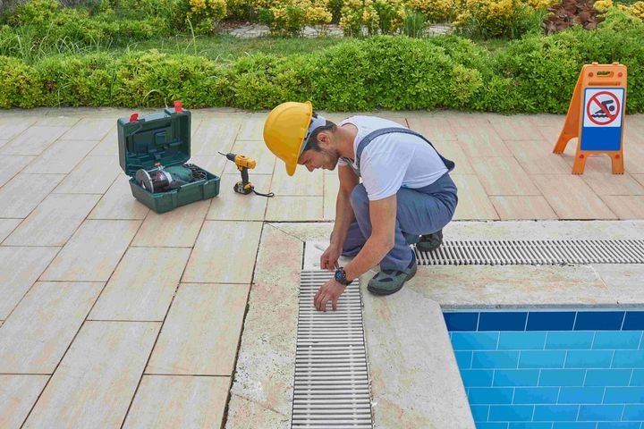 Man checking and repairing the pool