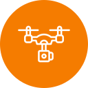 A white line-art icon of a drone with a camera attached, centered on a solid orange circular background.
