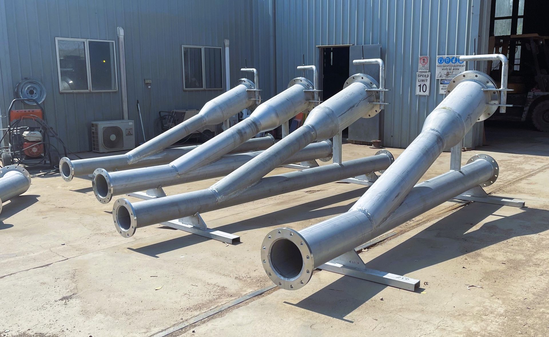 Several Metal Pipes Outside a Building