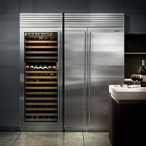 A stainless steel refrigerator with a wine cooler inside of it