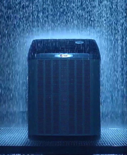 Trane air conditioner siting in the rain
