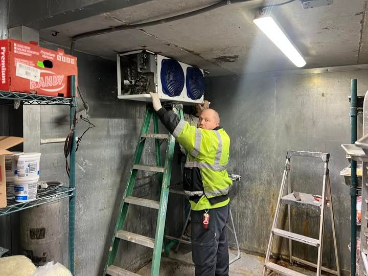 Commercial cooler Josh installing an evaporator