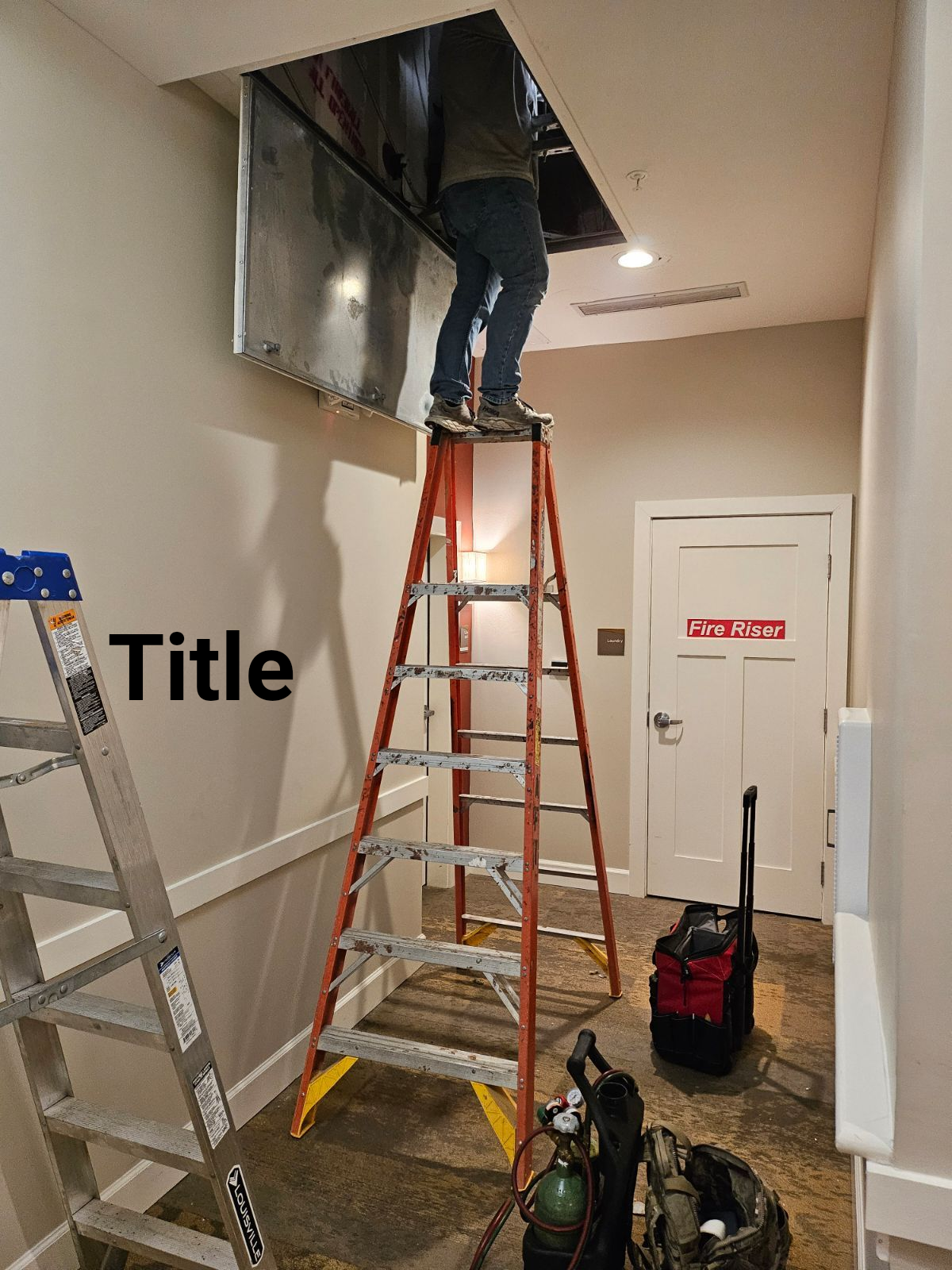 John Davis, owner of John's Heating, Cooling, and Appliance Repair, is standing on a ladder in a hallway repairing a Lennox air handler