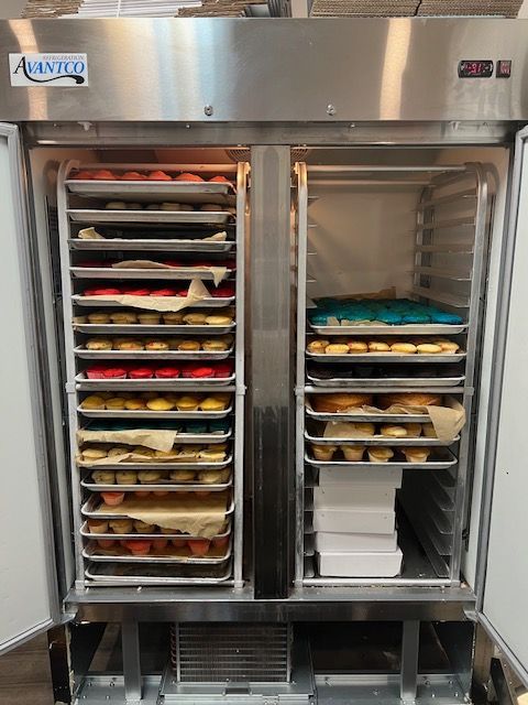 A stainless steel refrigerator with the door open