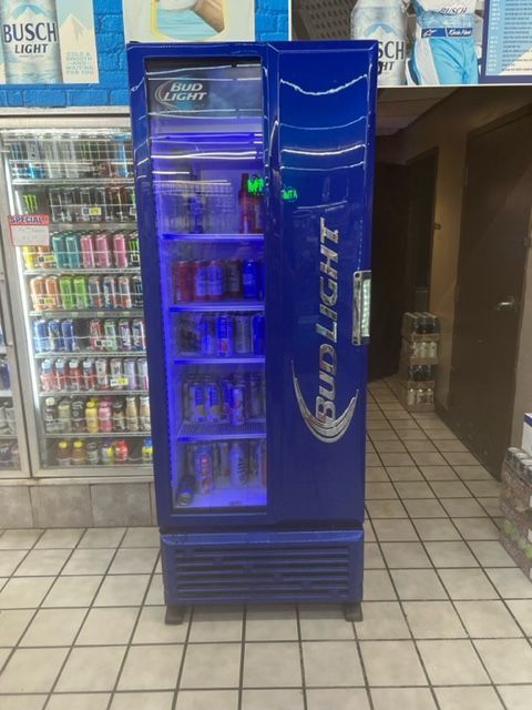 A bud light cooler is sitting in a store