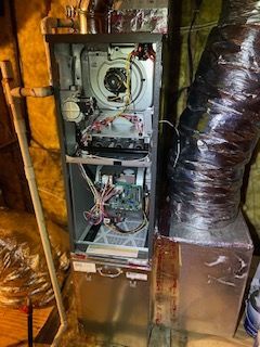A gas furnace is being installed in Peachtree City by John's Heating, Cooling, and Appliance Repair. 