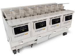 A fryer with a lot of baskets and drawers on a white background.
