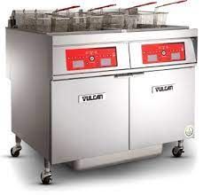 A stainless steel fryer with a lot of baskets on it.