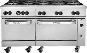 A stainless steel commercial stove with two ovens and wheels.