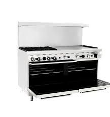 A black and white photo of a commercial stove with the door open.