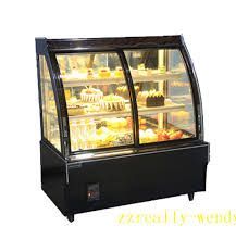 A display case filled with lots of cakes and desserts.