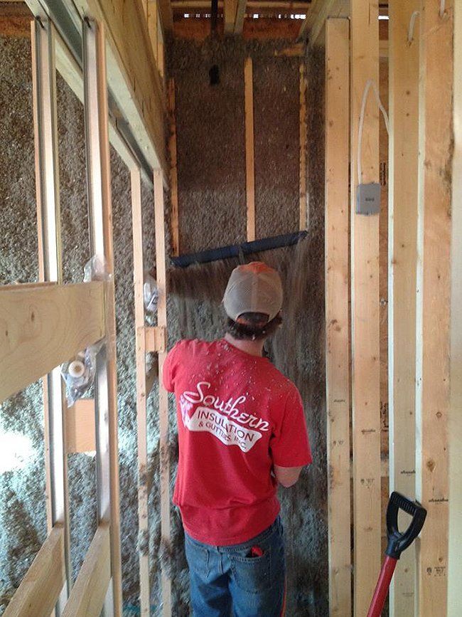 Worker Installing Cellulose Insulation — Hot Springs, AR — Southern Insulation & Gutters Inc