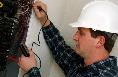 Electrician in action — Commercial and Institutional Electrical Work in Hampden, MA