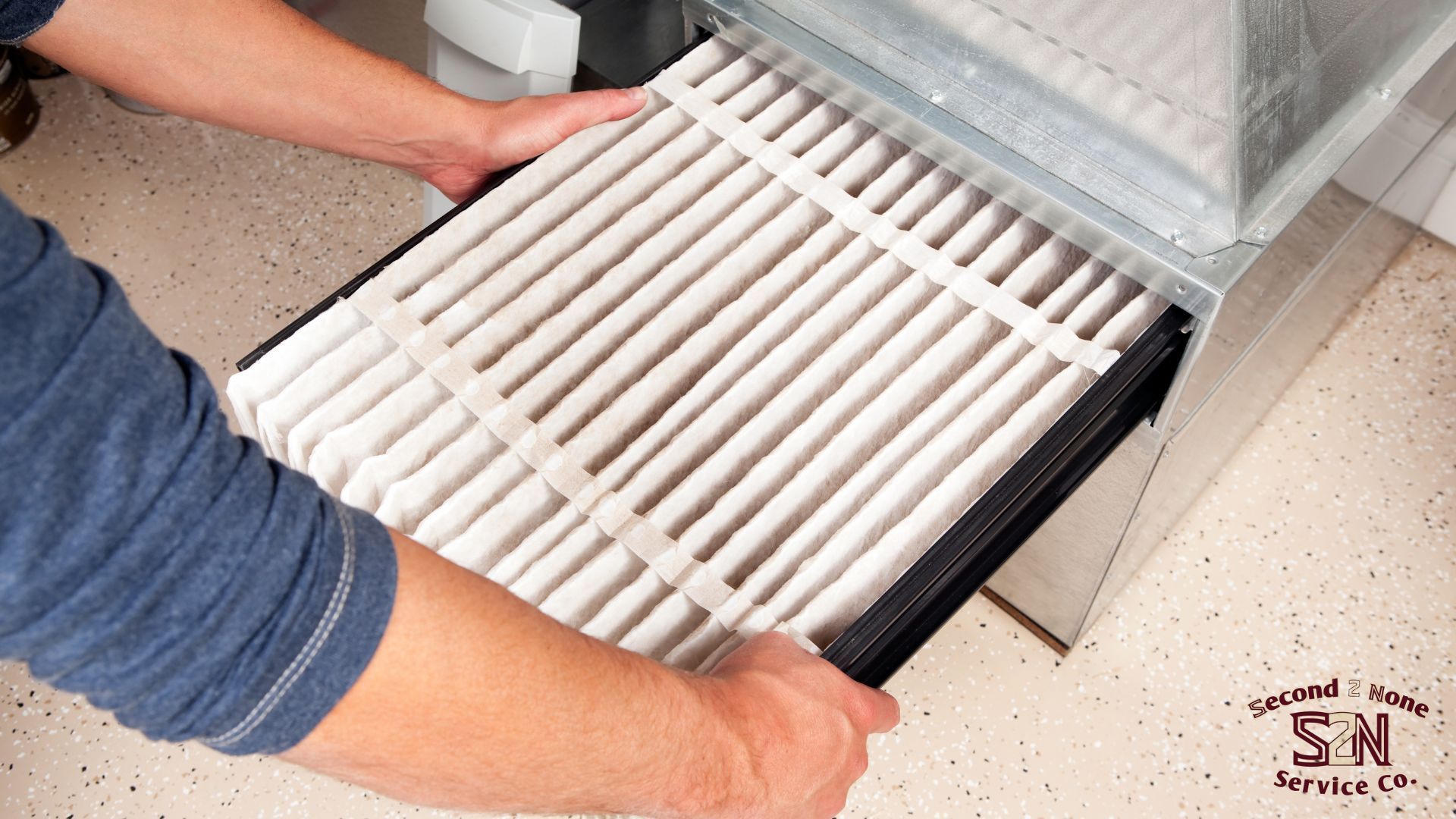 A person is changing a filter on a heater in Columbus Ga.