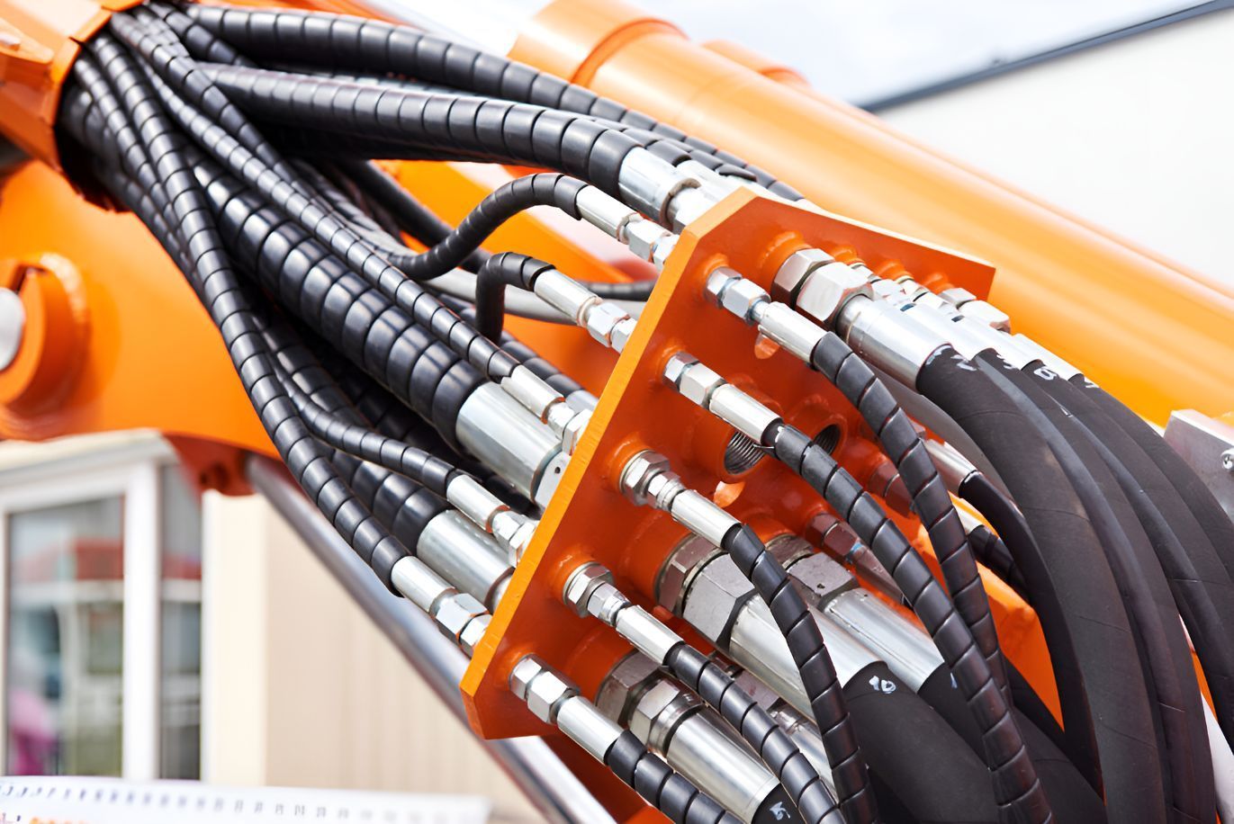 A Close Up Of A Bunch Of Hydraulic Hoses On A Machine — Belt Maintenance & Supplies Pty Ltd In Nindaroo, QLD