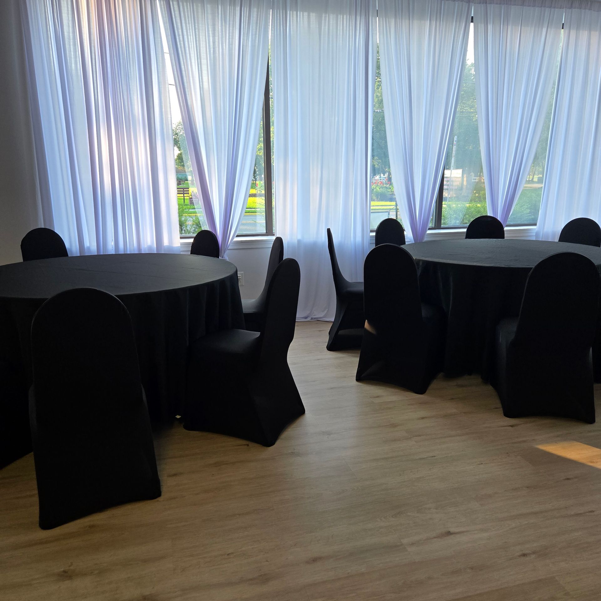 A large room with tables and chairs in it