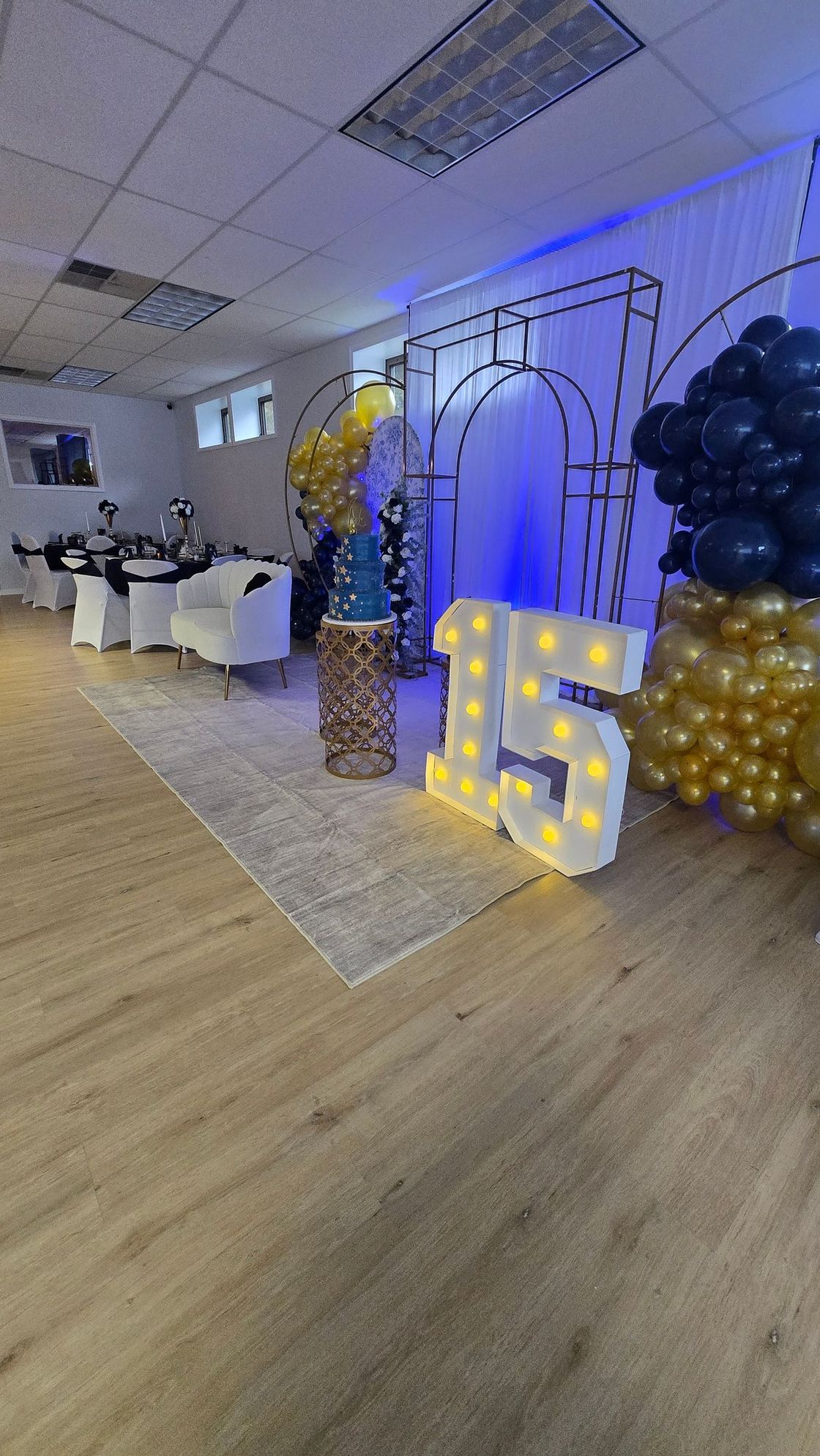 A room with a bench , mirror , and heart on the wall.