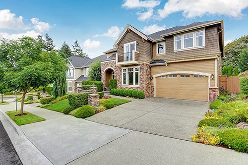 Nice home with green grass and trees