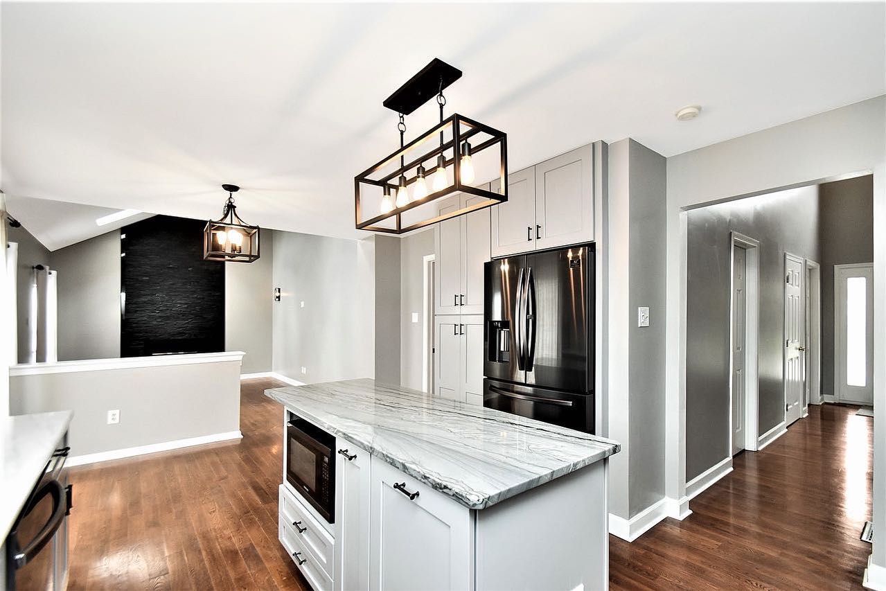 A kitchen with a large island in the middle of it.