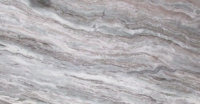 A close up of a marble counter top with a swirl pattern.
