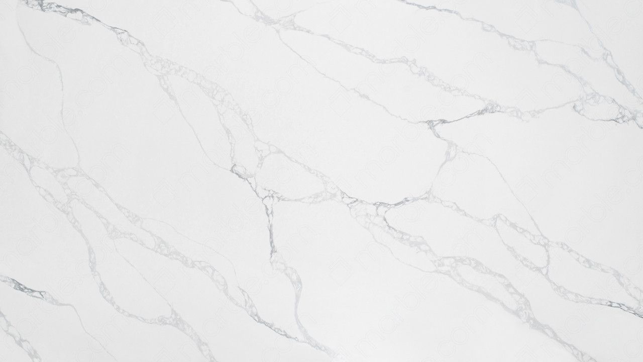 A close up of a white marble counter top.