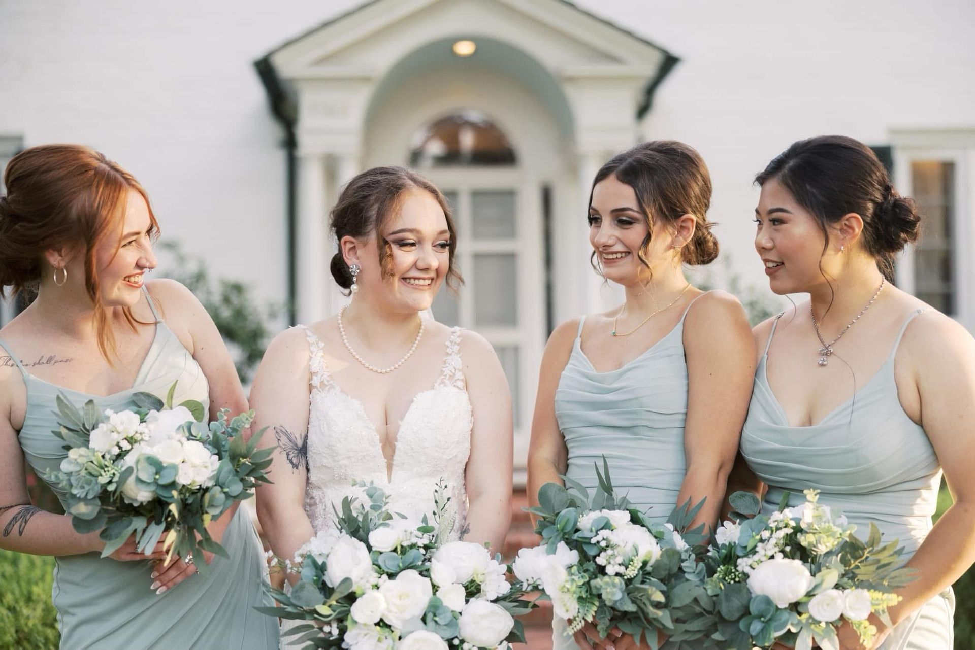 Confetti falls over a crowd at an illuminated music festival, green and gold lights in the background.