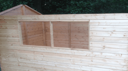 A large timber shed under construction
