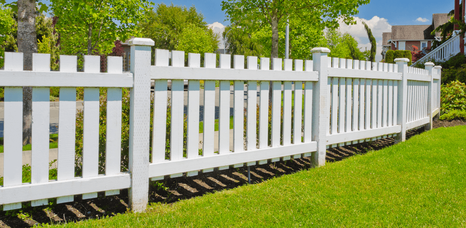 A white wooden picket fence
