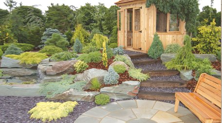 A patio and landscape garden with timber shed