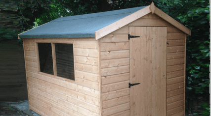 A wooden shed with a felt roof