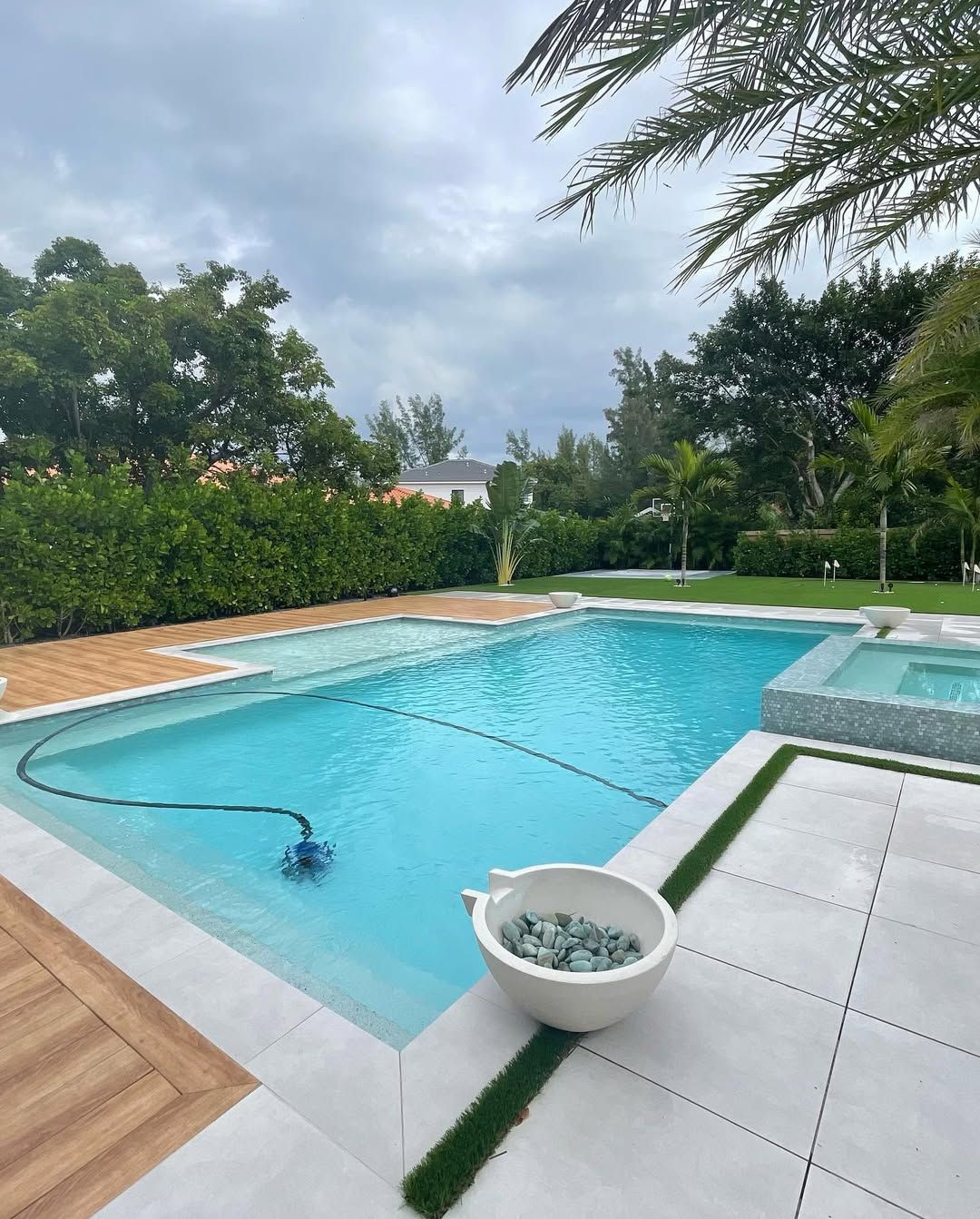 Luxury swimming pool construction with integrated spa by expert swimming pool contractors in South Florida