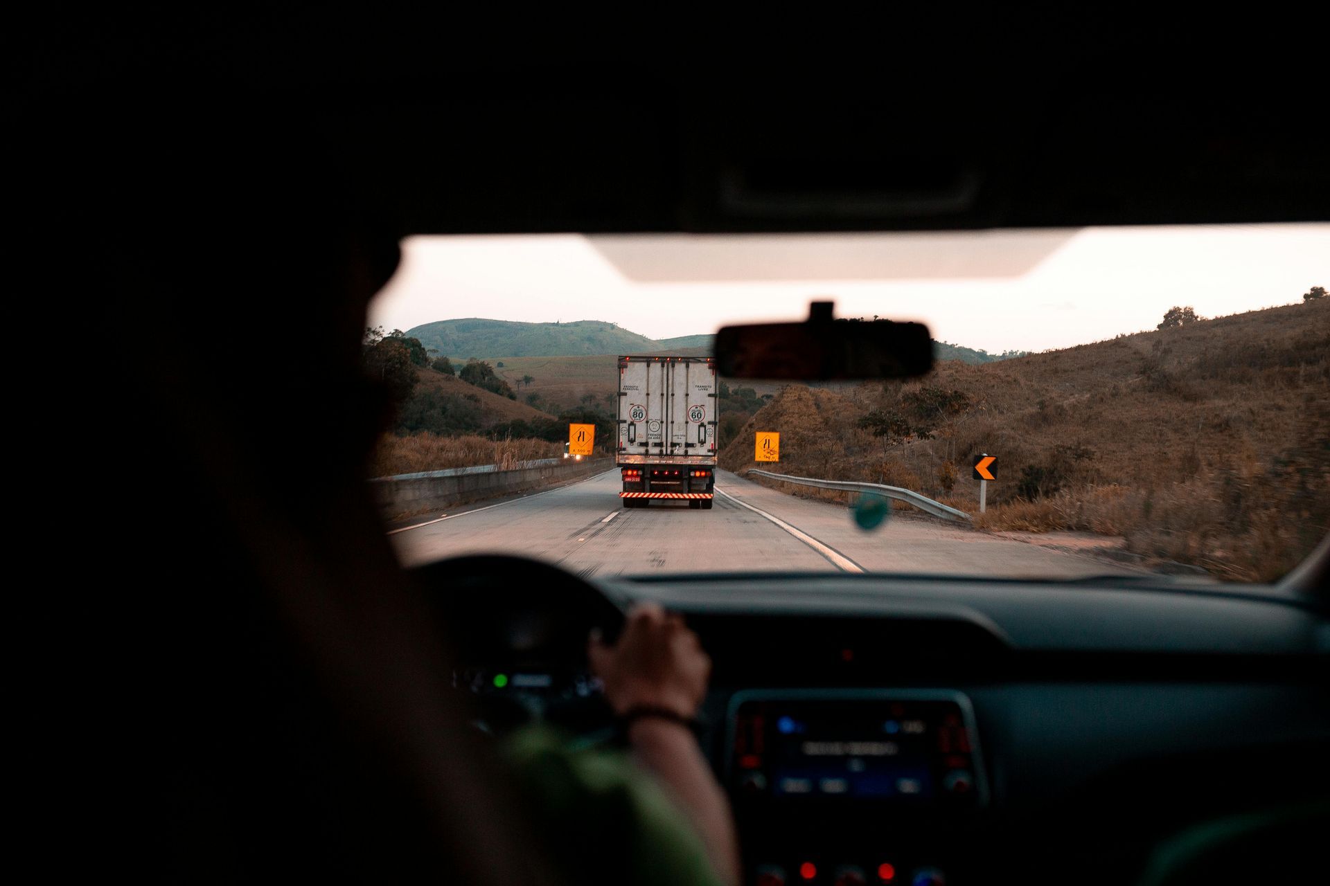 A person is driving a car down a highway.