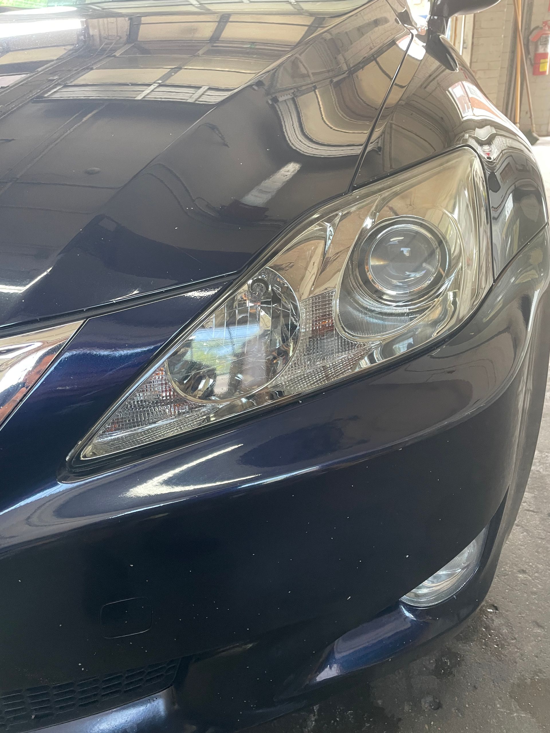 A set of black car mats with a cadillac logo on them.
