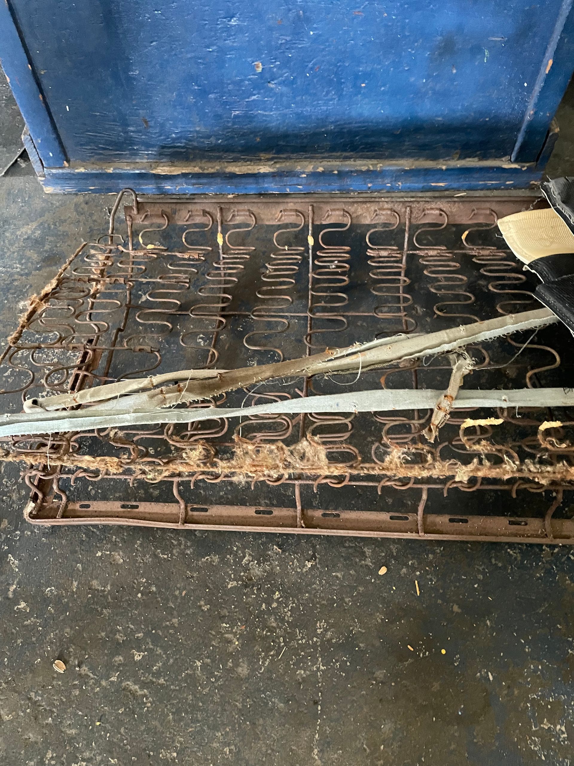 A black jeep is parked in front of a boat store