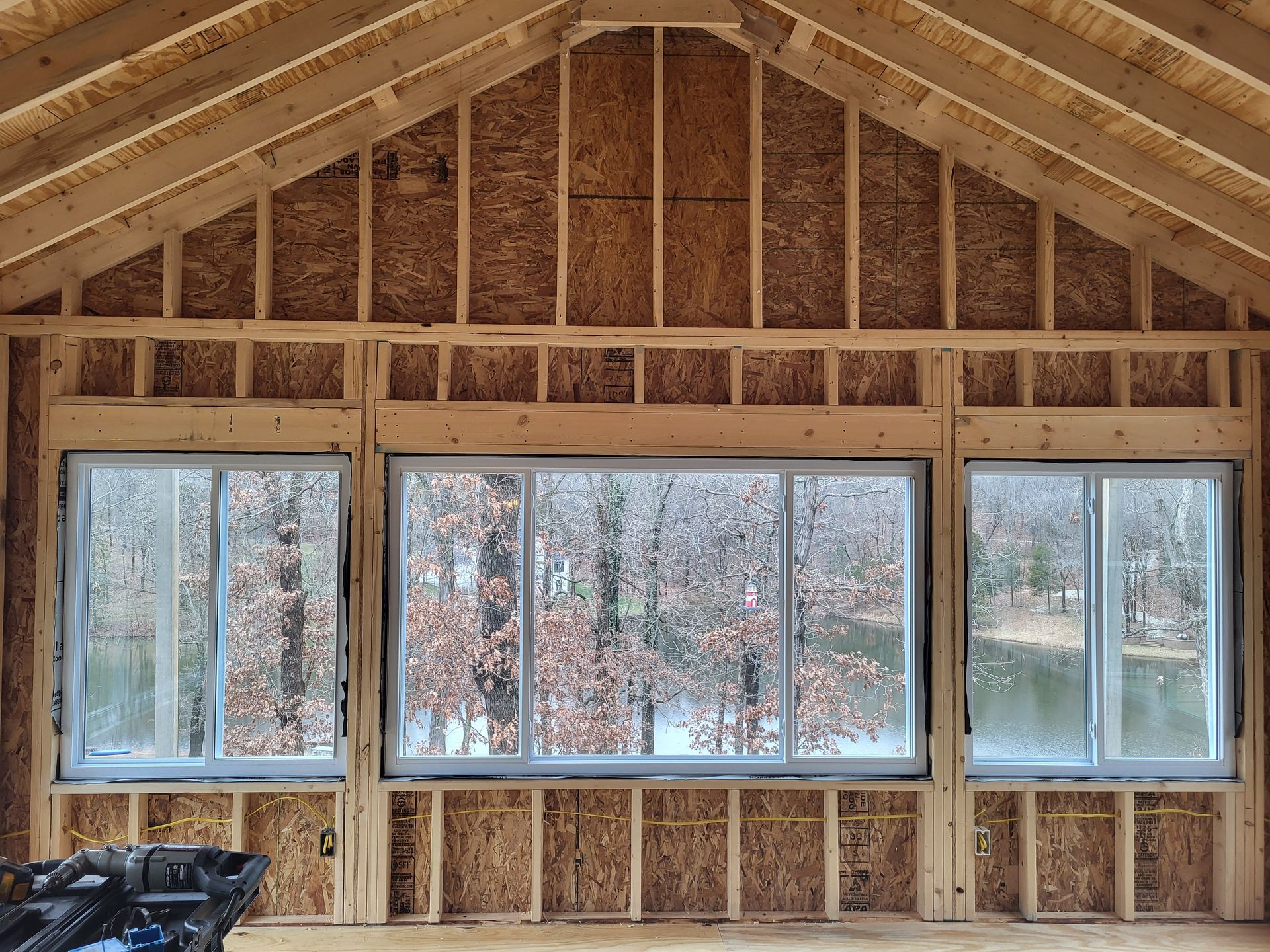 A house is being built with a lot of windows.