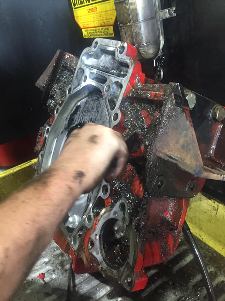 Mechanic Repairing The Red Engine Truck — Mid North Coast Heavy Vehicle Repairs In Kempsey, NSW