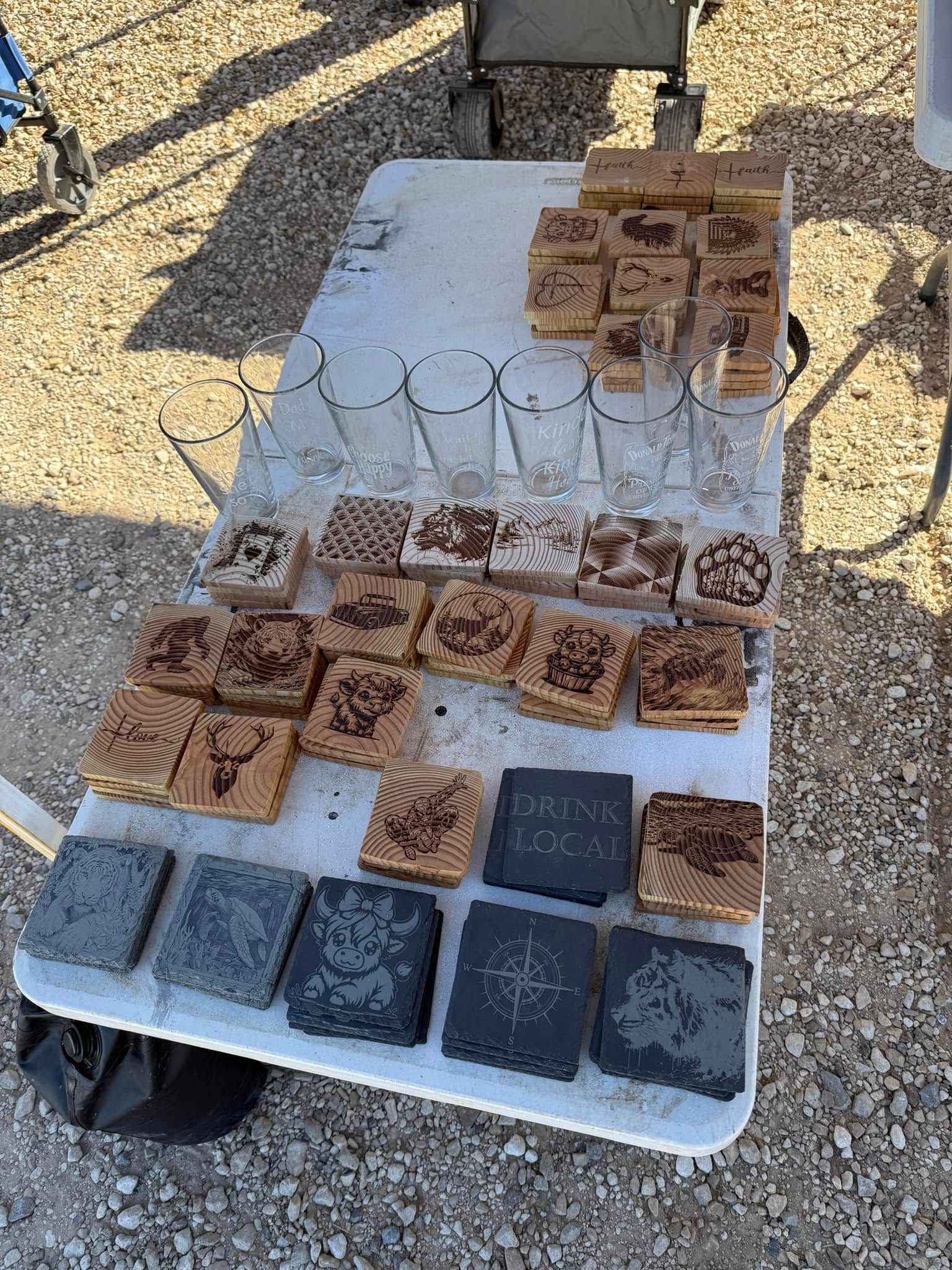 A table with a lot of coasters and glasses on it.