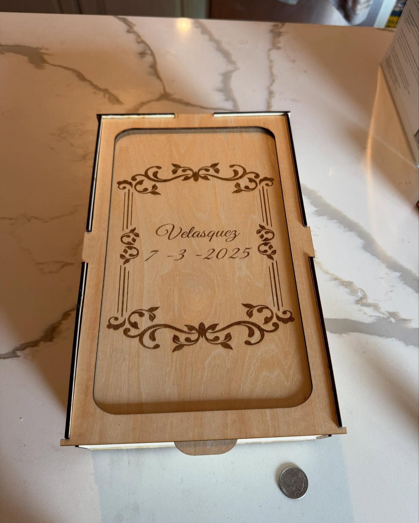 A wooden box with the date 7 8 2025 on it