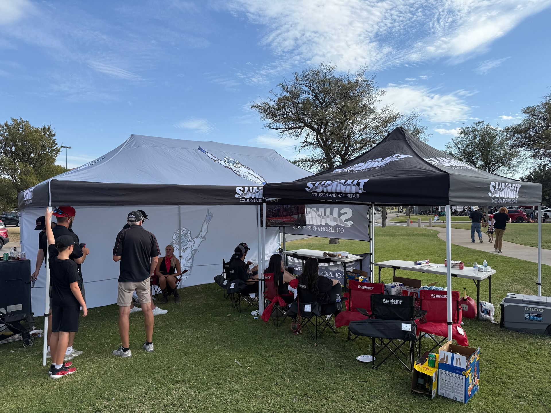 A man wearing a hard hat and goggles is standing in a room.