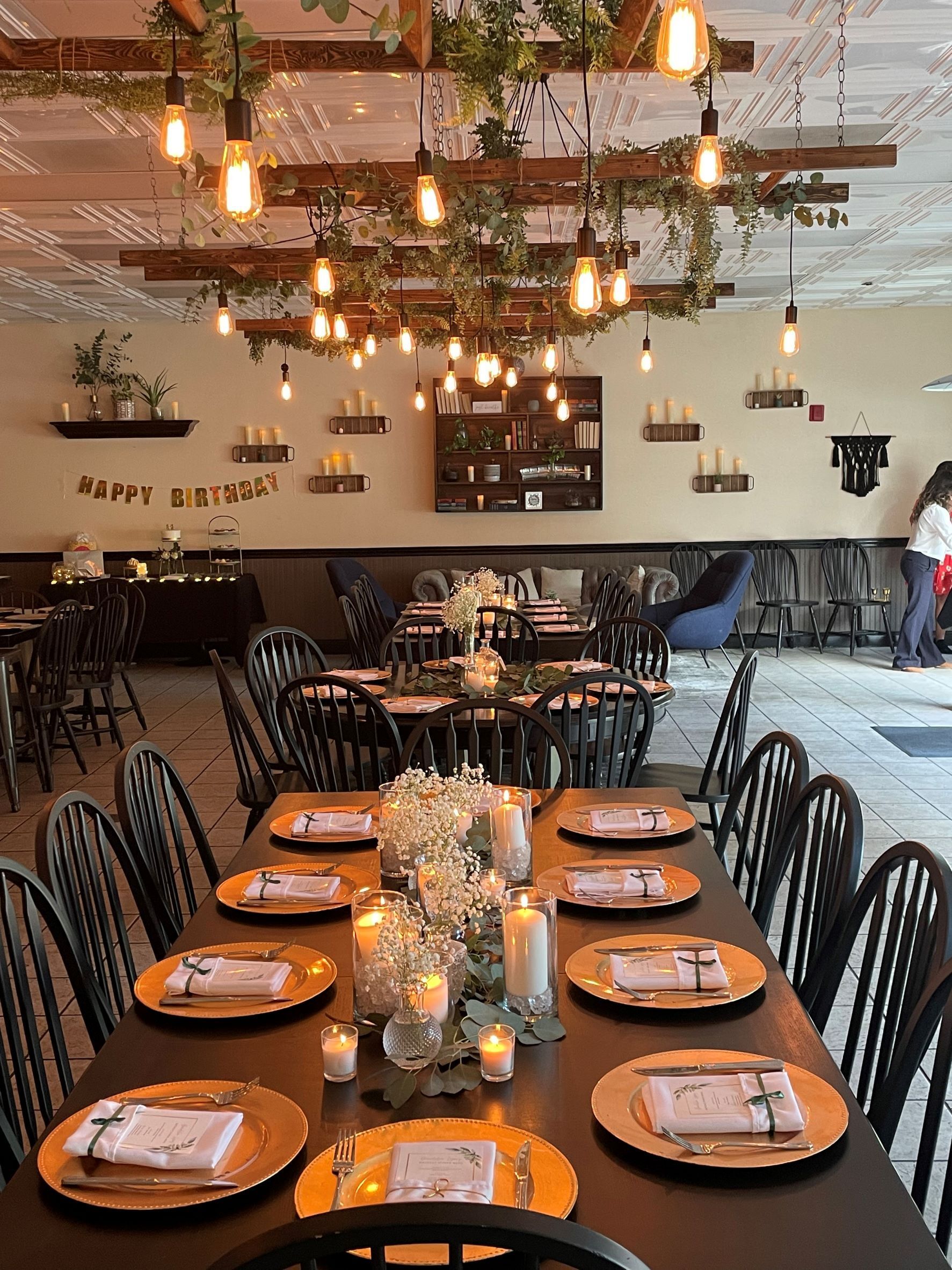 Wine Country Catering sets the ambience for a rehearsal dinner with hanging bistro lights and elegant table settings at The Nook in Temecula, CA