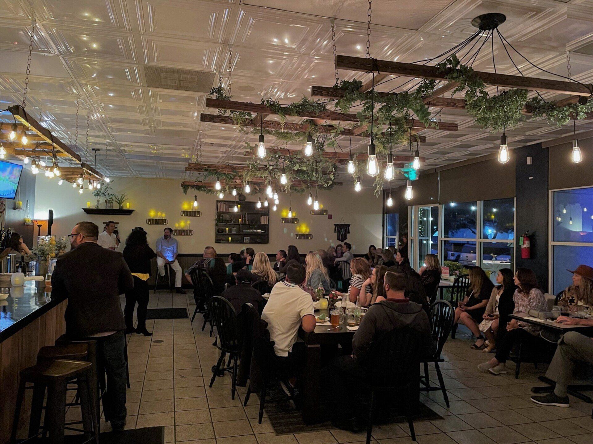 A man gives a speech at a rehearsal dinner at The Nook in Temecula, CA hosted by Wine Country Catering