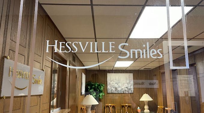 A room with a sign that says hessville smiles on it