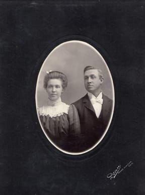 A black and white photo of a man and woman