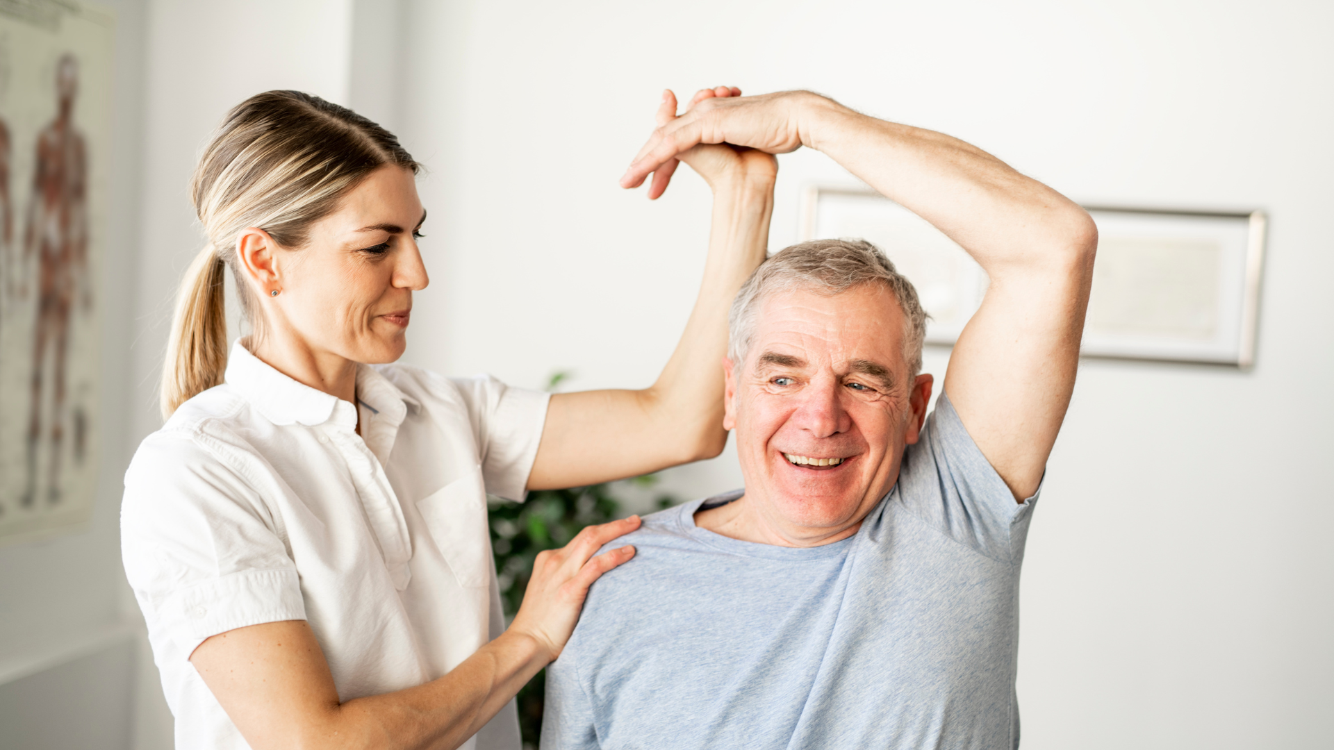 physiotherapist helping elderly man
