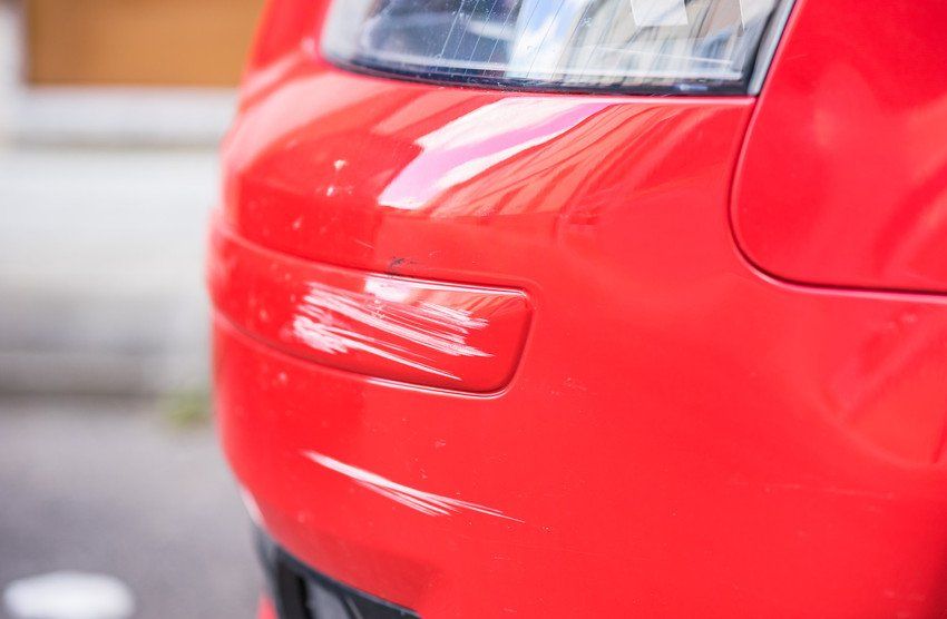 side view of red car wheel arch