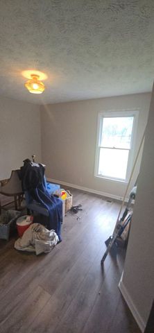 A living room filled with furniture and a window.